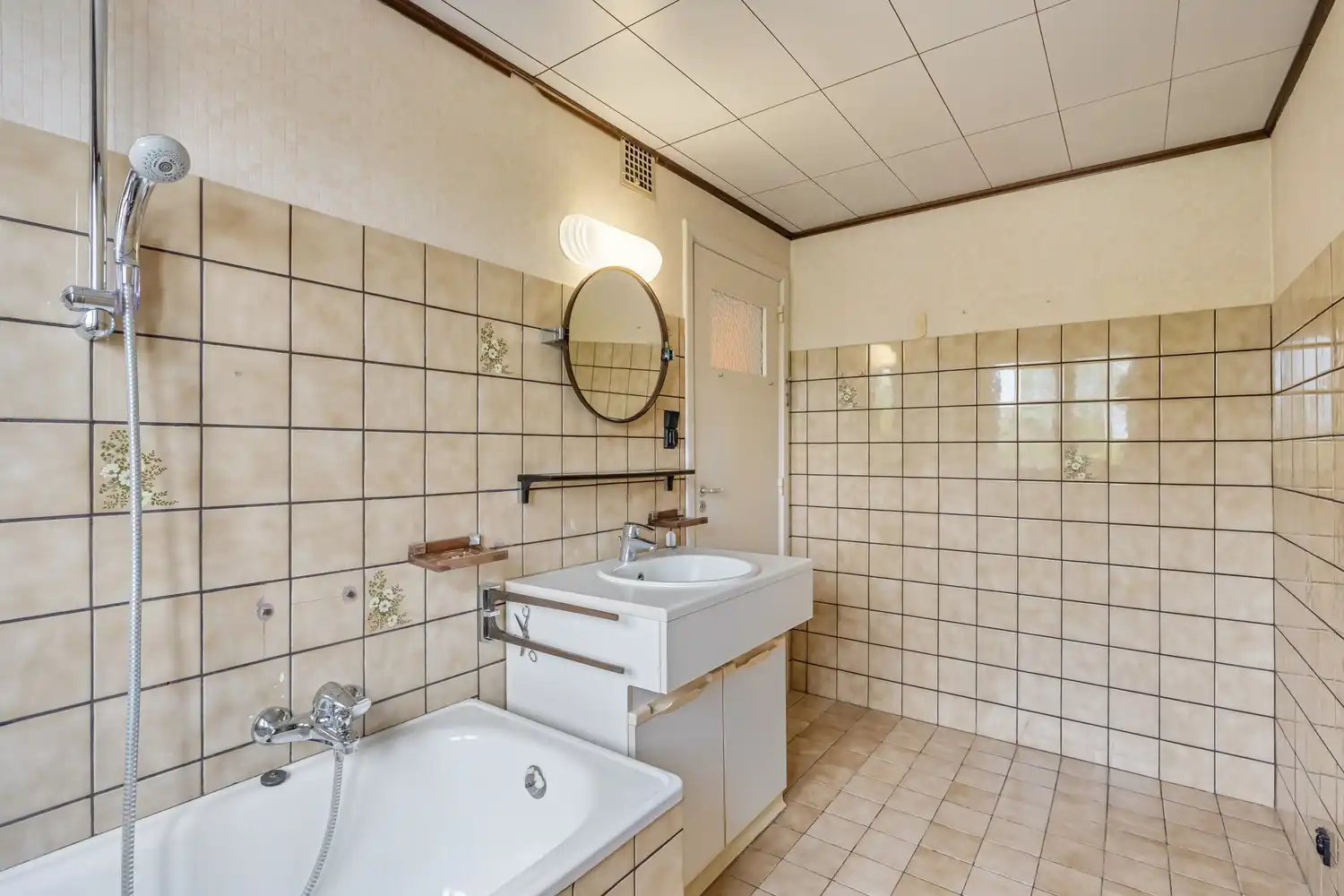 Goed gelegen woning met 4 slaapkamers, een garage en een diepe tuin in een verkeersluwe straat te Kessel-Lo! foto 21