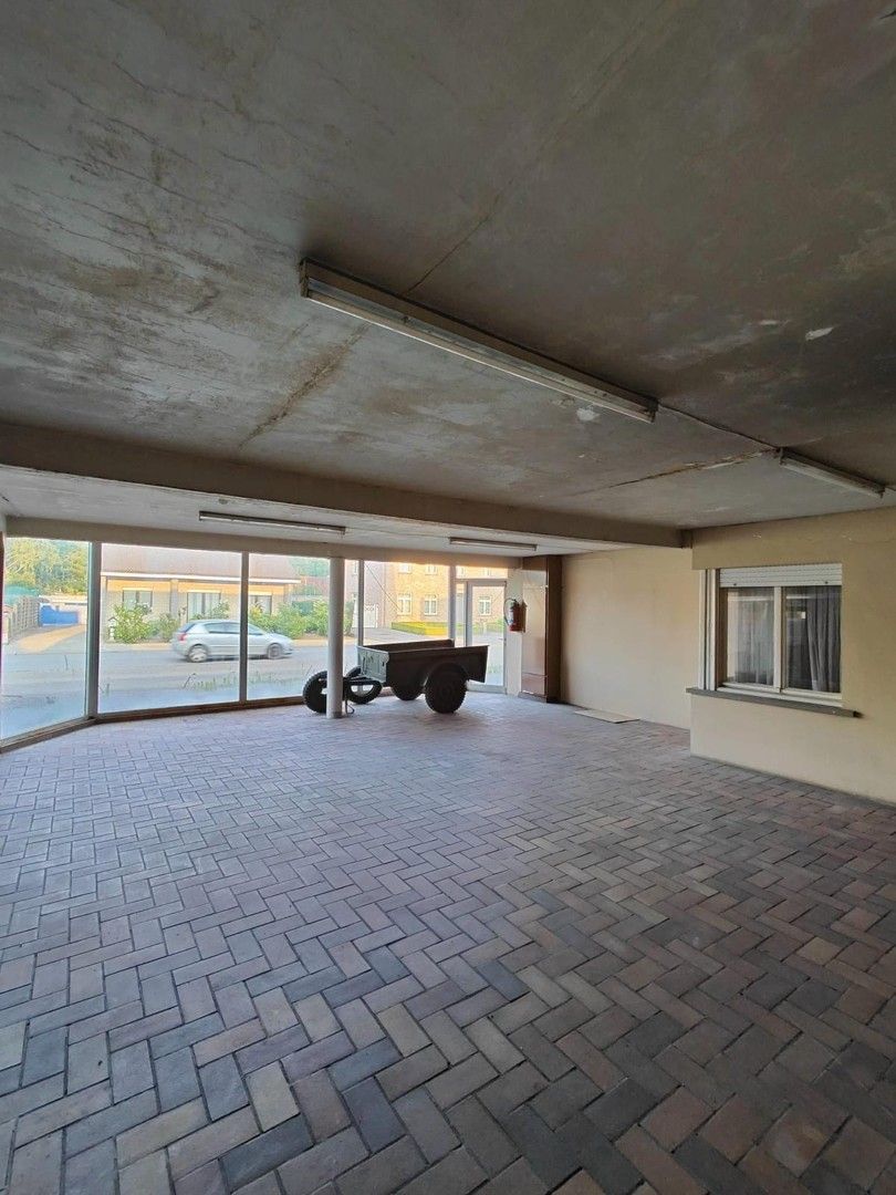 Woning met loods en voormalige showroom foto 23