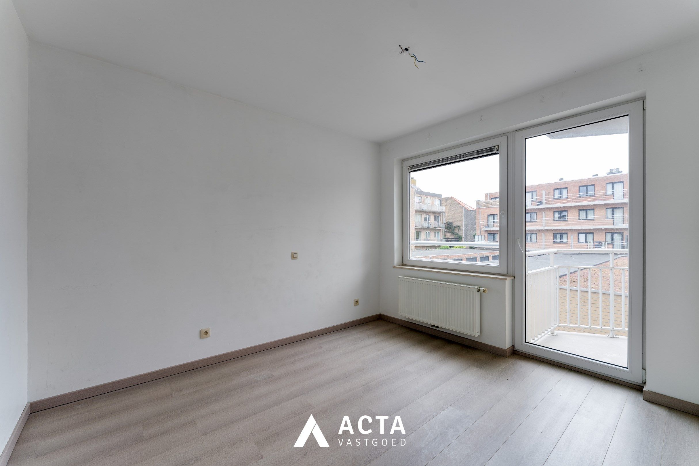 Nieuwbouwappartement met twee slaapkamers en terras in Mariakerke foto 8