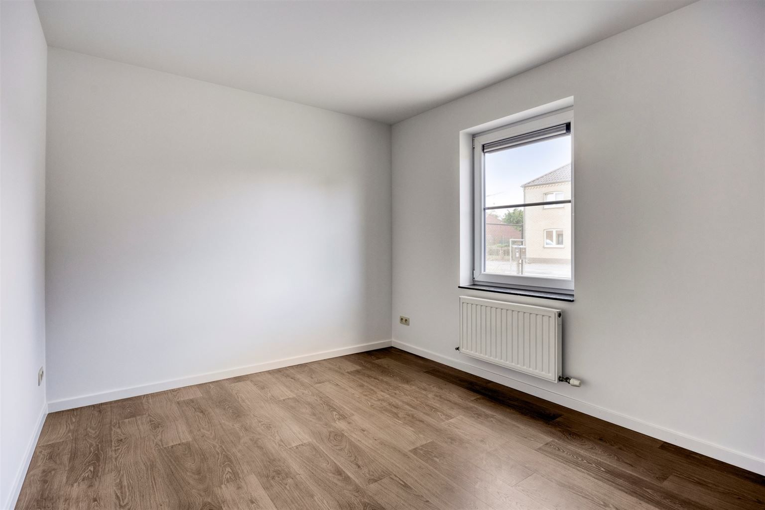 Instapklaar gelijkvloers appartement met 2 slaapkamers, ruime tuin en parkeergelegenheid op een rustige toplocatie in Opitter.  foto 15