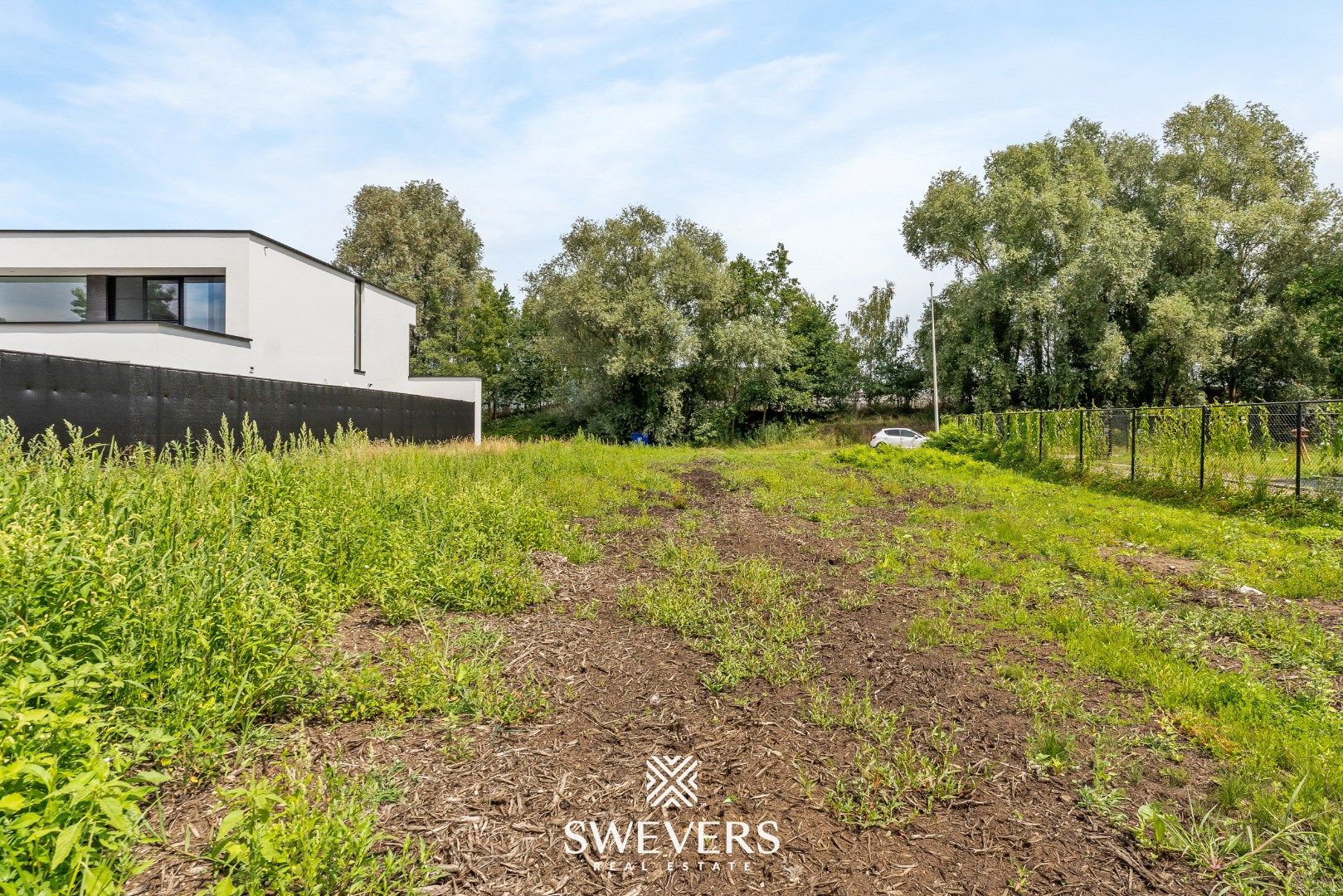 Bouwgrond voor open bebouwing met blijvend groen zicht in rustige straat  foto 9