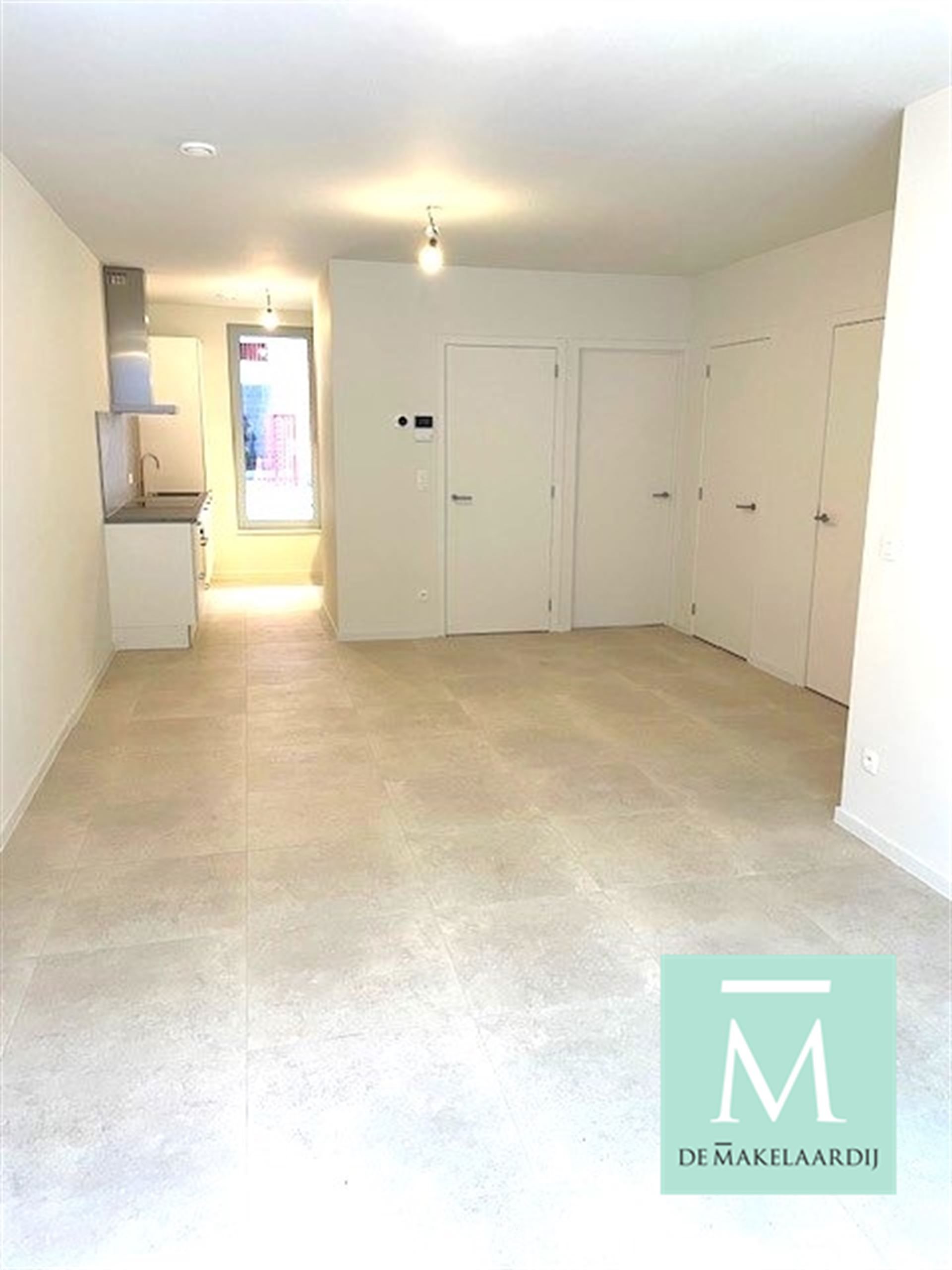 Gelijkvloers nieuwbouwappartement met 2 slaapkamers, terras/tuin op toplocatie! foto 2