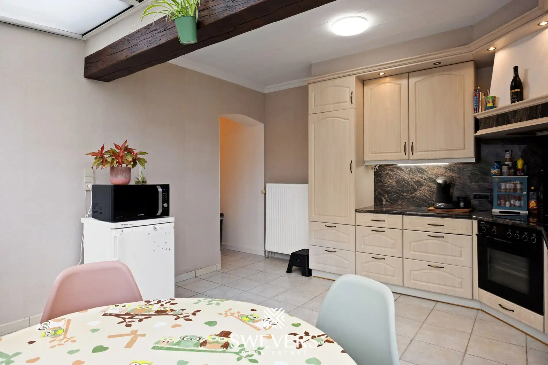 Open bebouwing met 3 slaapkamers en garage in rustige straat foto 12