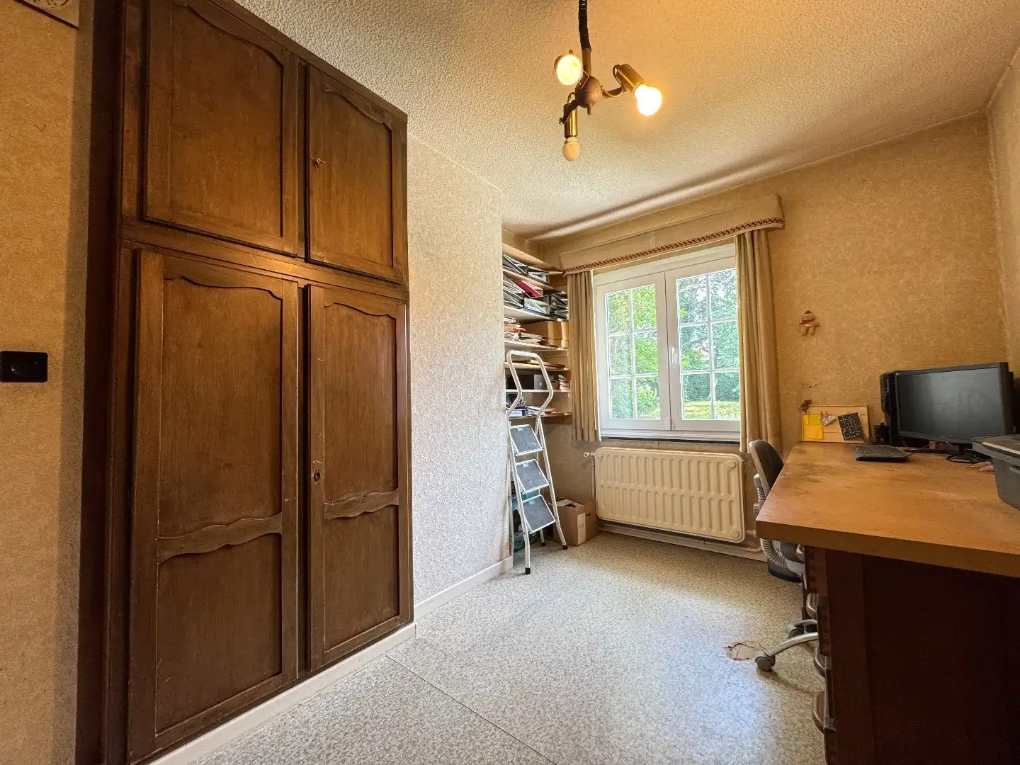 Charmante 3-gevelwoning met garage en tuin foto 10