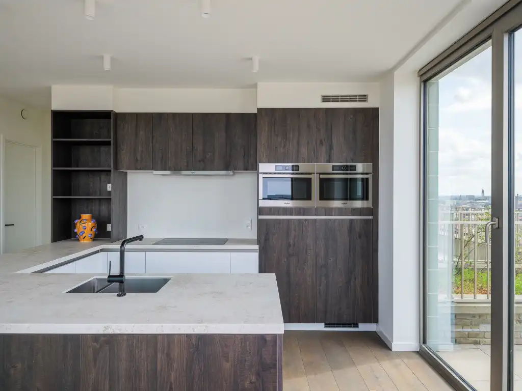 Penthouse met twee volwaardige slaapkamers en een uitzonderlijk terras met panoramisch zicht over Gent en zijn torens. foto 3