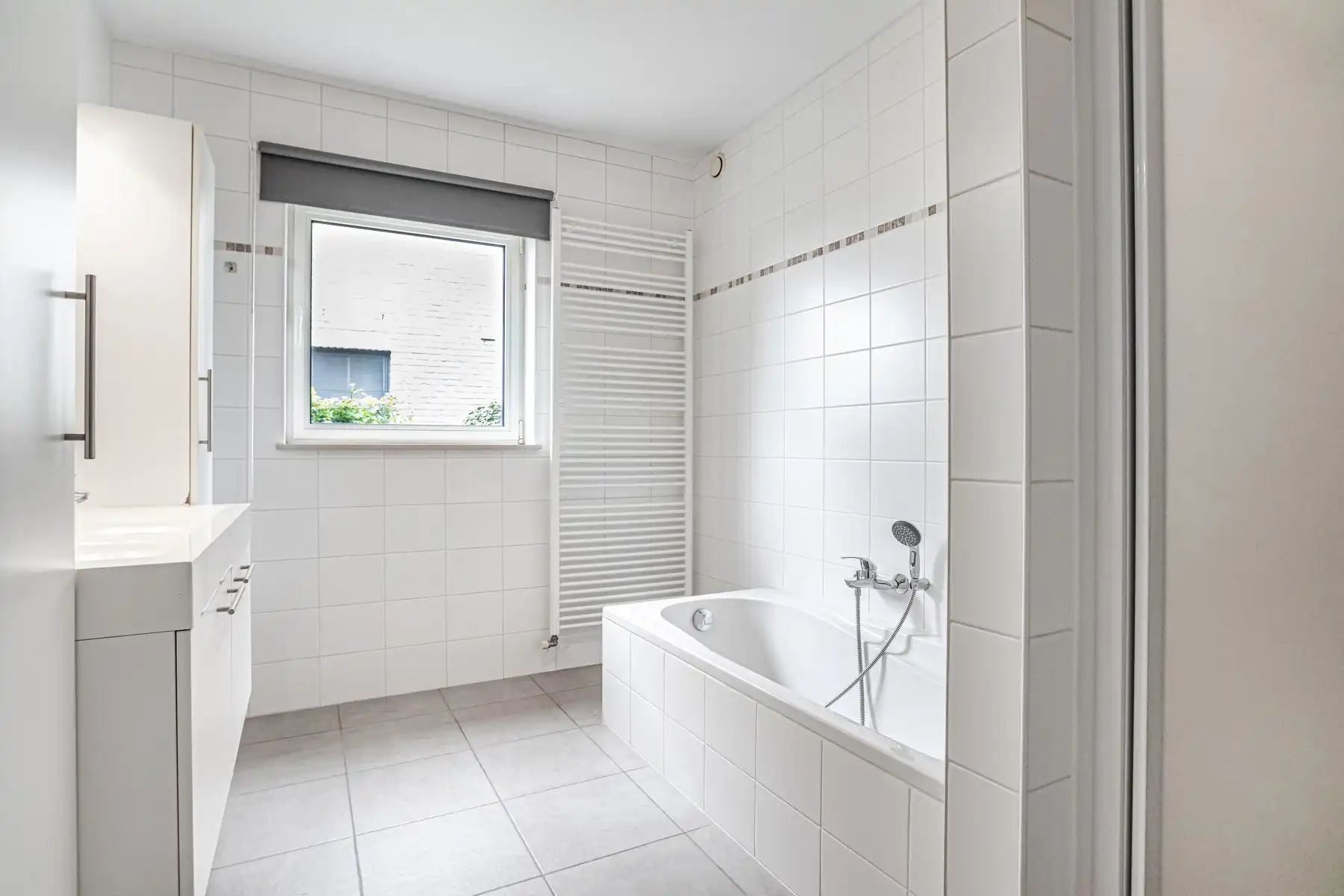 Instapklaar gelijkvloers appartement met privatieve tuin foto 12