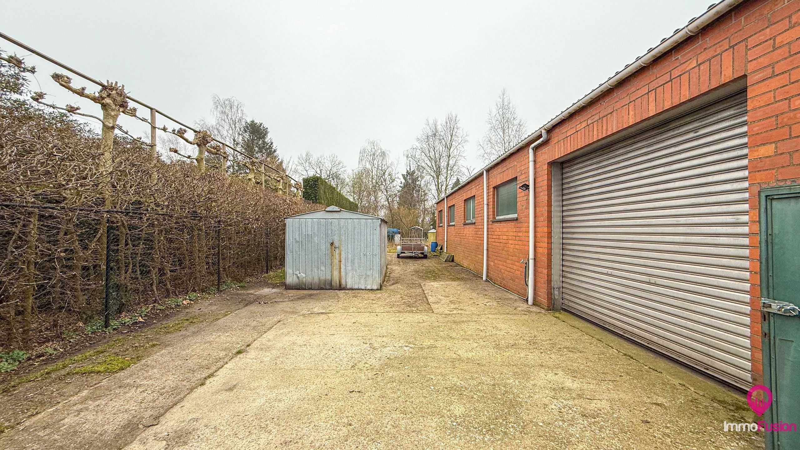 Prachtige brede bouwgrond met magazijn op 20 are! foto 33