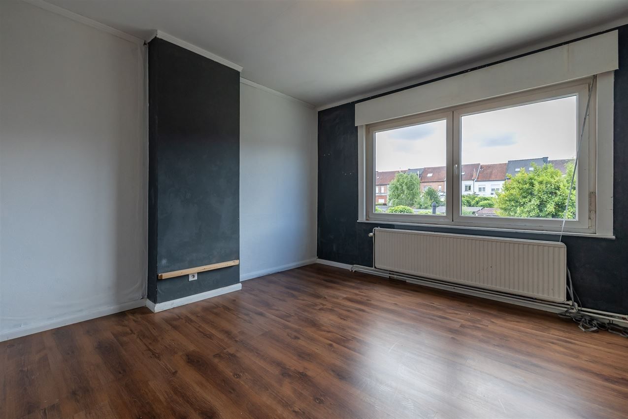 Ruime woning met zuidgerichte tuin en garage in rustige straat nabij centrum. EPC C en 5+ slaapkamers. foto 21