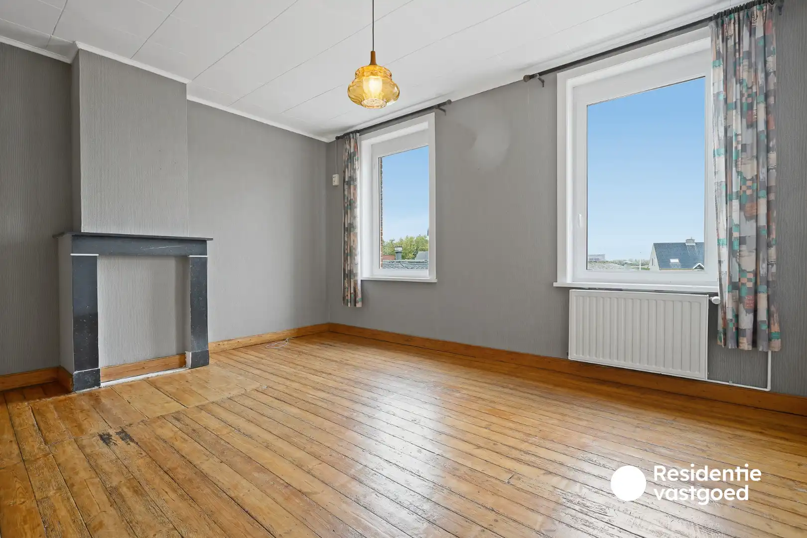 Veelzijdig eigendom met handelsruimte, ruime woning en bouwgrond in centrum Merkem! foto 13