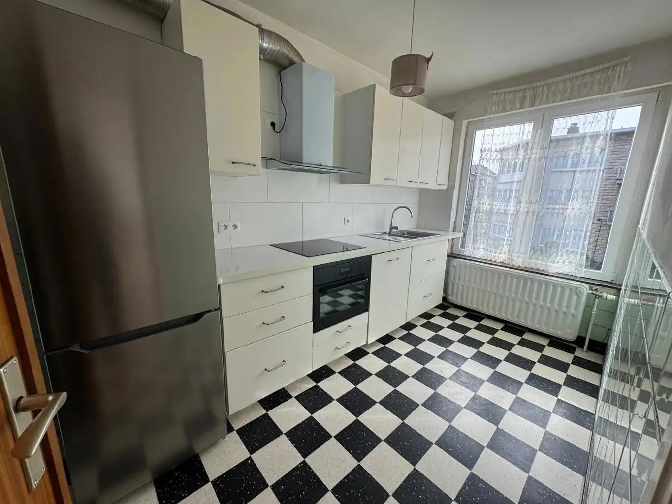 Opbrengsteigendom met 3 appartementen, tuin en 2 garages foto 11