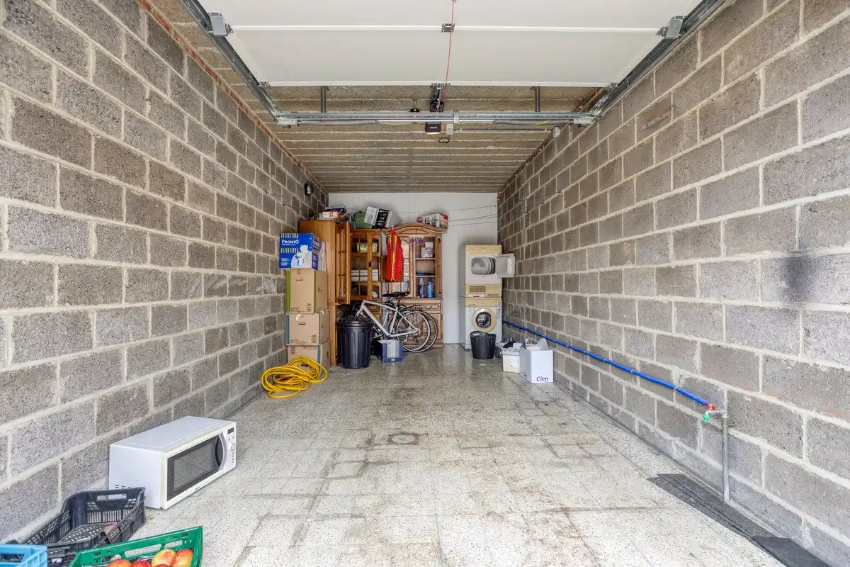 Opbrengsteigendom met 3 appartementen, garages en tuin foto 29