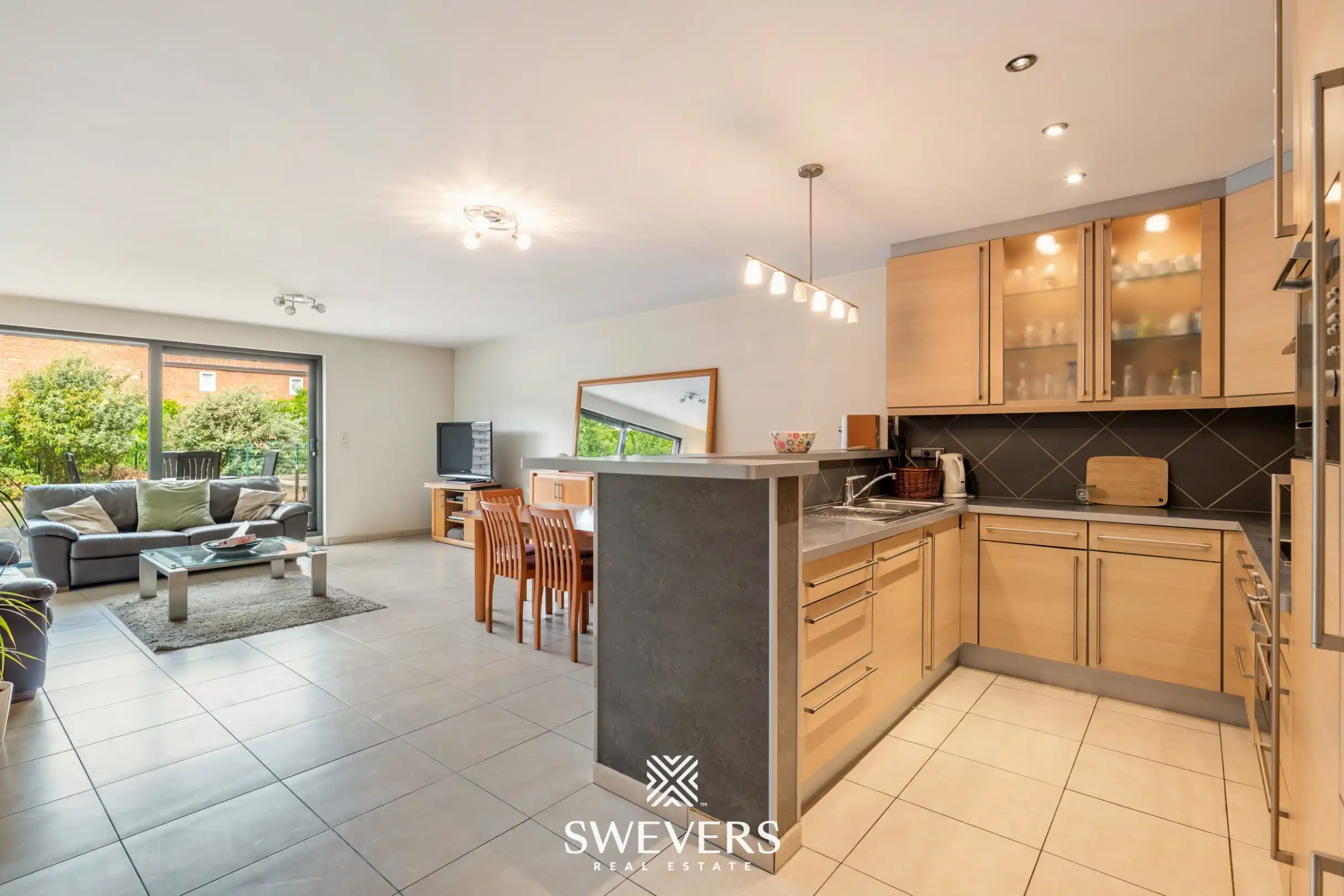 Uitstekend gelegen appartement met 2 slaapkamers, private tuin en ondergrondse staanplaats foto 3