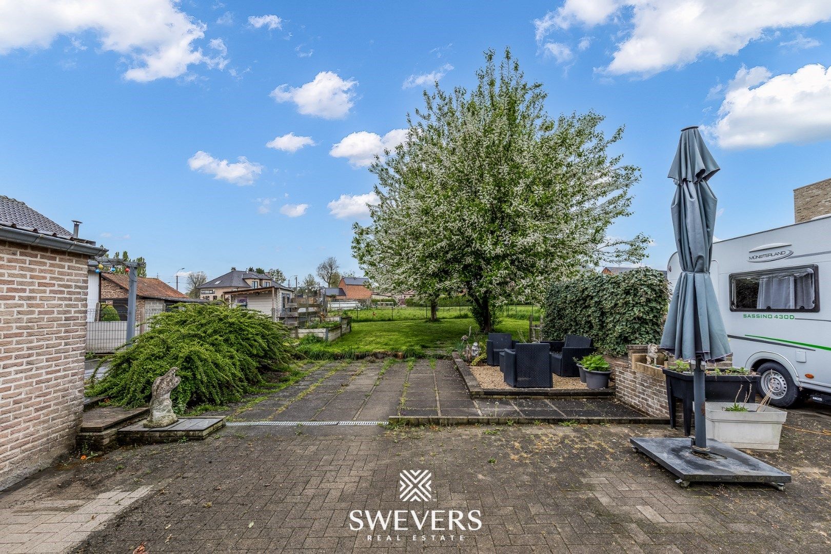 Gezellige woning met veranda, garage & zonnige tuin foto 30