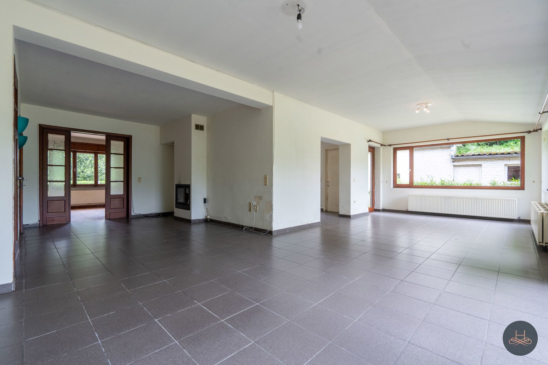 Achterliggende gezinswoning op rustgevend perceel foto 6