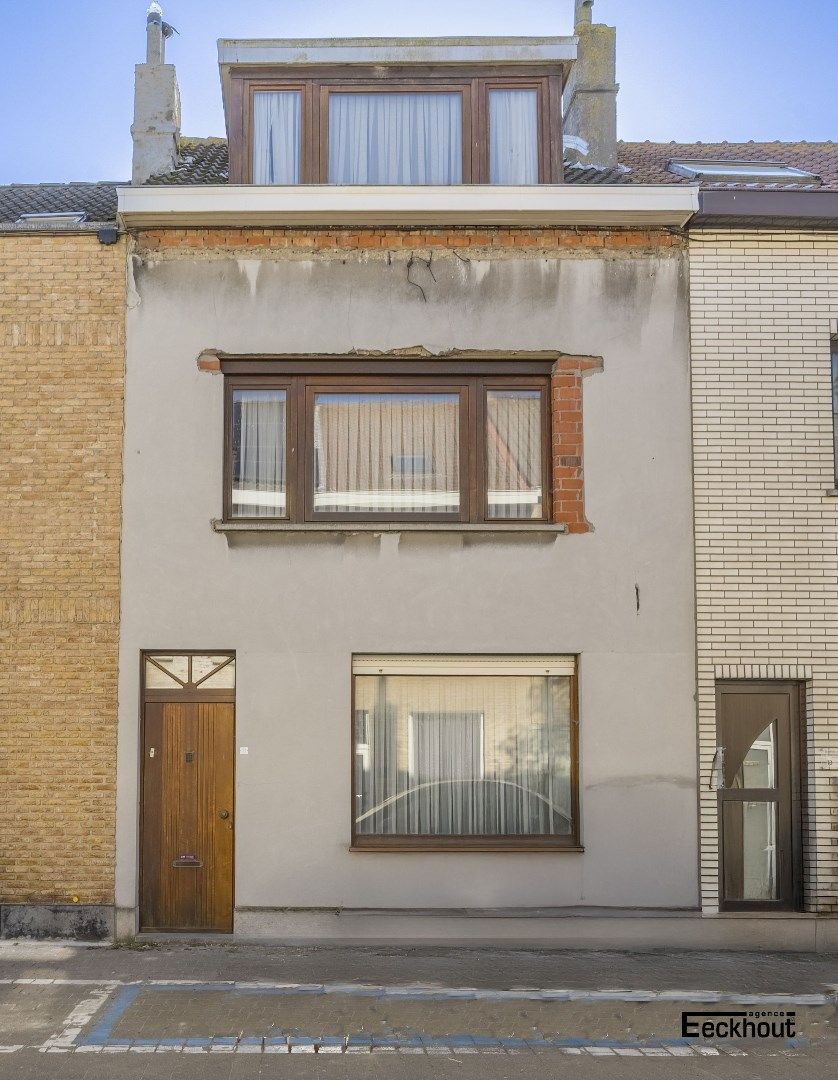 Te renoveren woning met diepe, zonnige tuin foto 17