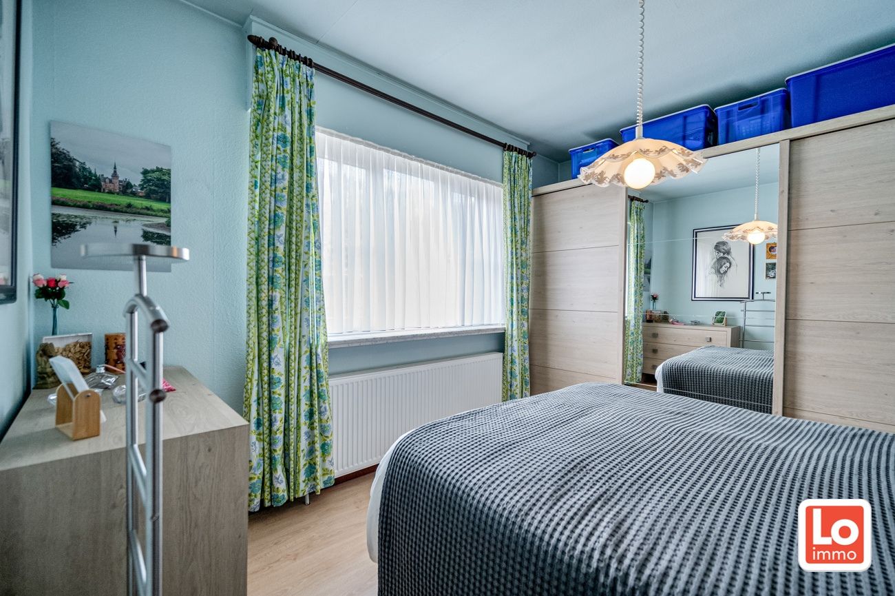 Degelijke alleenstaande woning met inpandige garage gelegen op een strategische locatie vlakbij Beervelde Dorp en het Park van Beervelde! foto 8