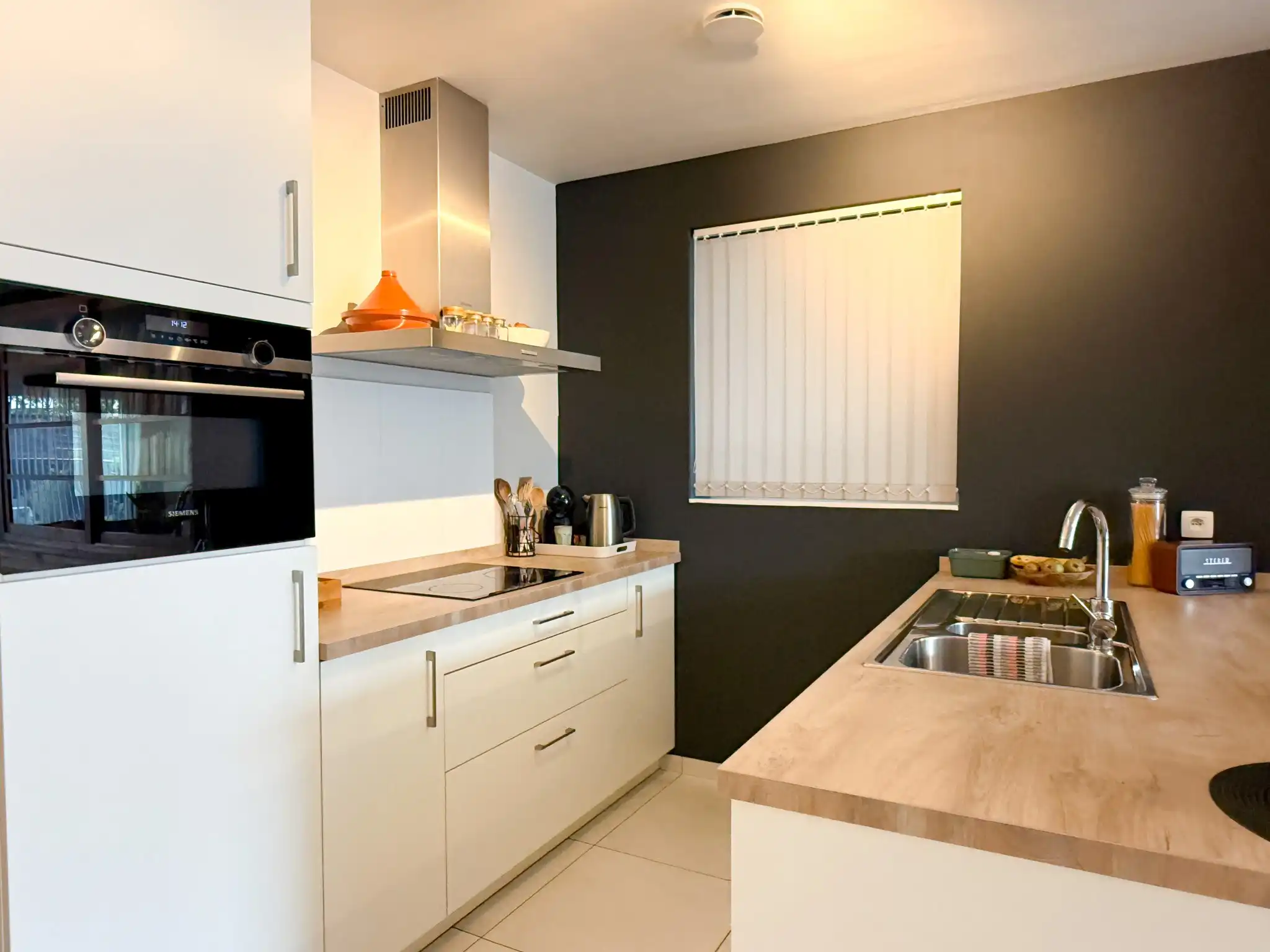 Gelijkvoers appartement met twee slaapkamers en tuin in het hartje van Beveren foto 2