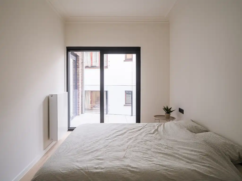 Stijlvol gerenoveerd 2-slaapkamerappartement met meerdere terrassen in het centrum van Gent foto 9