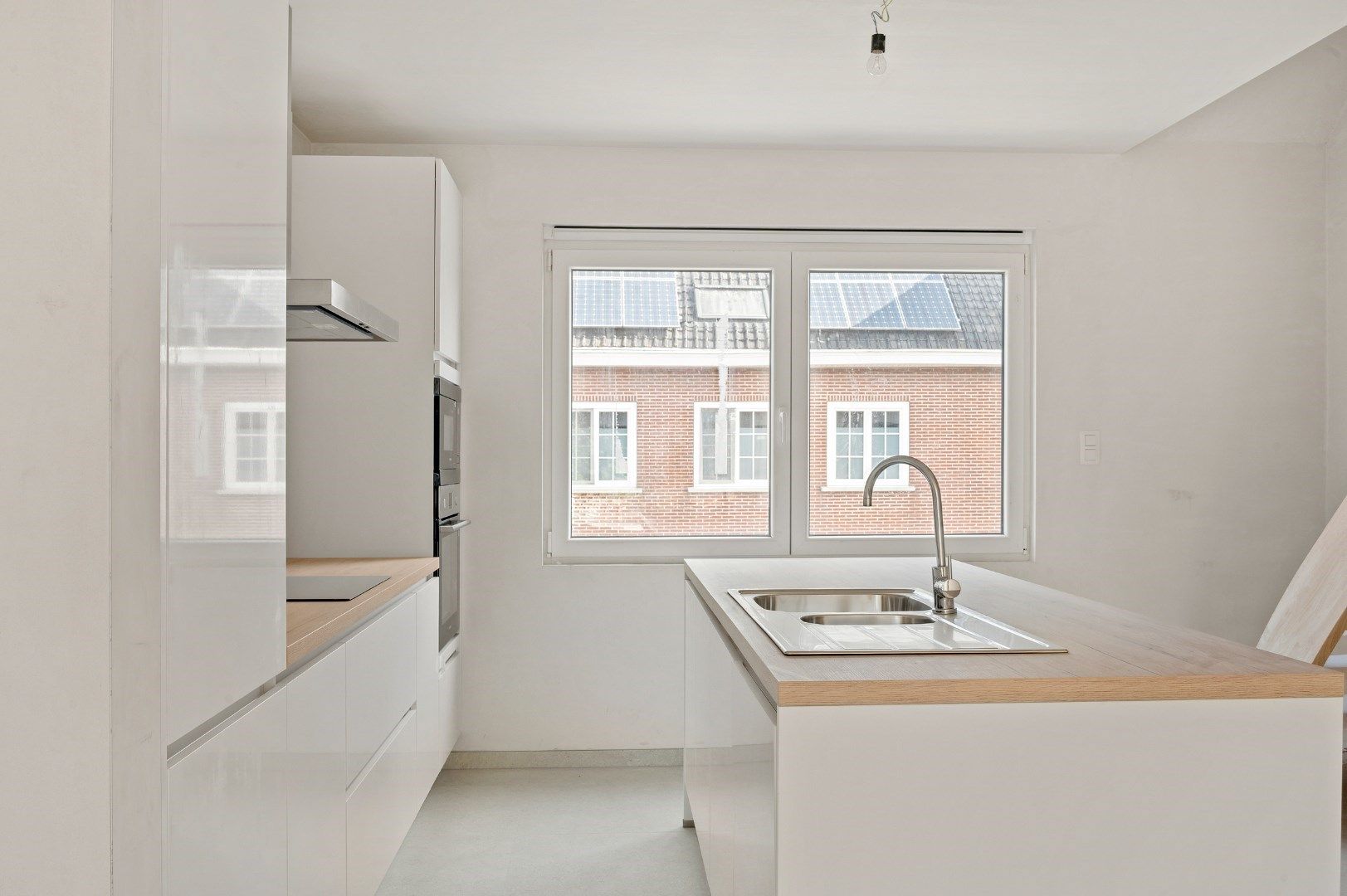 DUPLEX NIEUWBOUWAPPARTEMENT MET 2 SLPKS EN RUIM TERRAS TE GELUWE foto 7