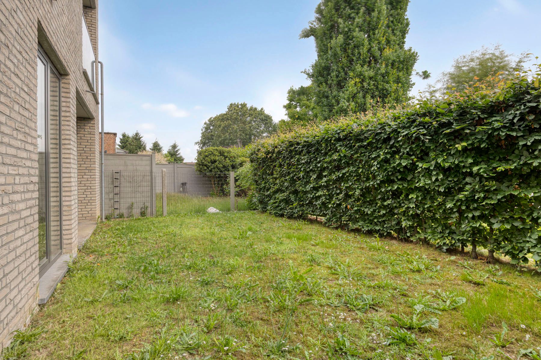 Ruim gelijkvloersappartement met tuin en garage foto 23