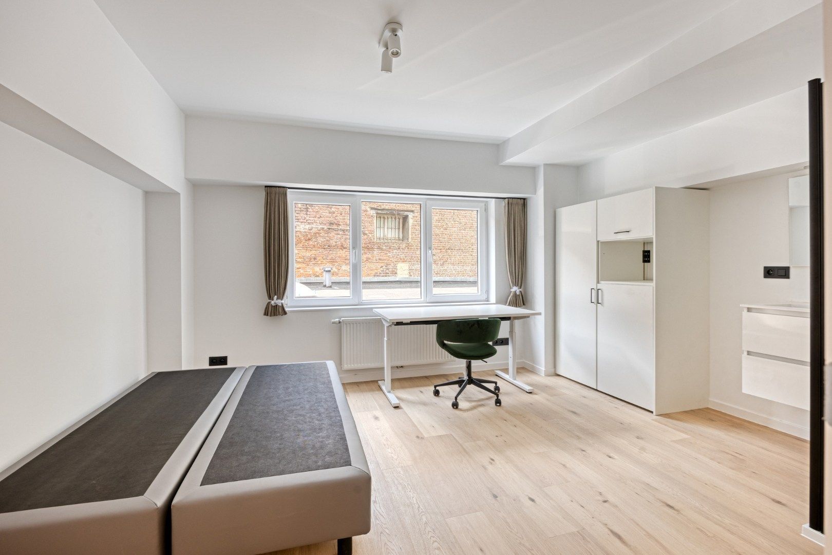 Volledig gerenoveerde studentenkamer in residentie met 29 studentenkamers in hartje Leuven - EPC label A! foto 5