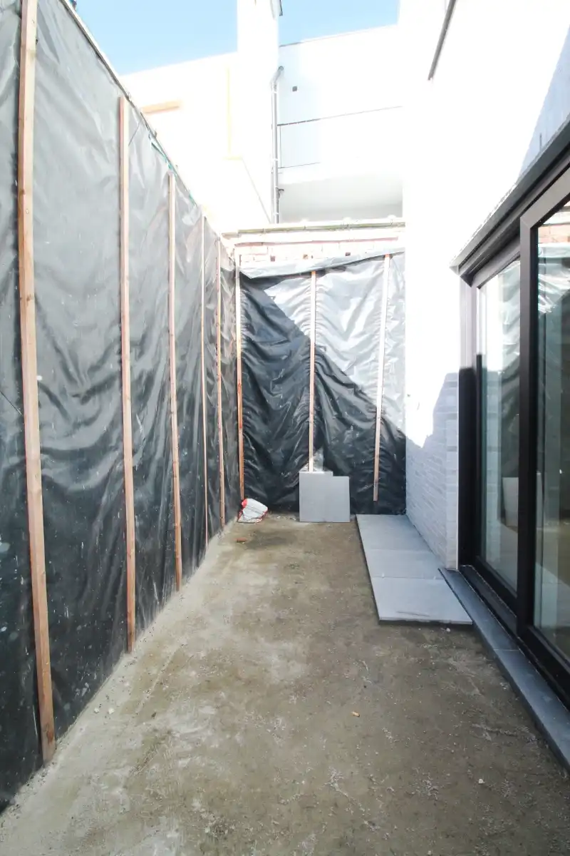 Gelijkvloers nieuwbouw appartement met zonnige tuin te Gent foto 7