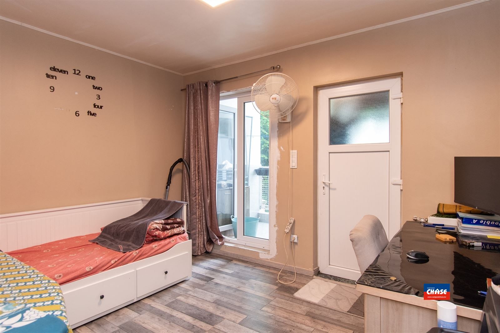 Opbrengsteigendom of kangoeroewoning met twee appartementen met elk twee slaapkamers en terrasje foto 8