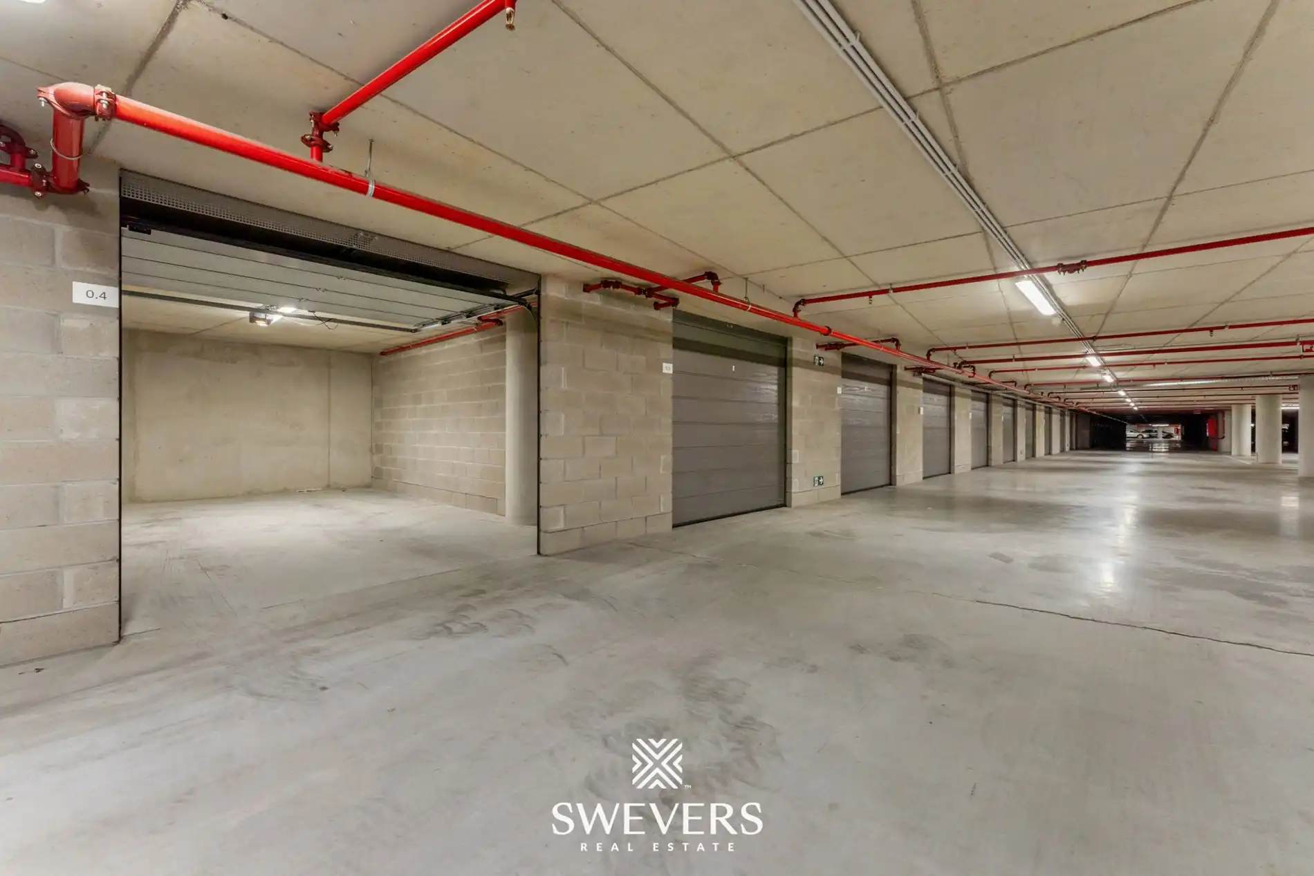 Ruime en beveiligde ondergrondse garagebox te huur in Quartier Blue foto 10