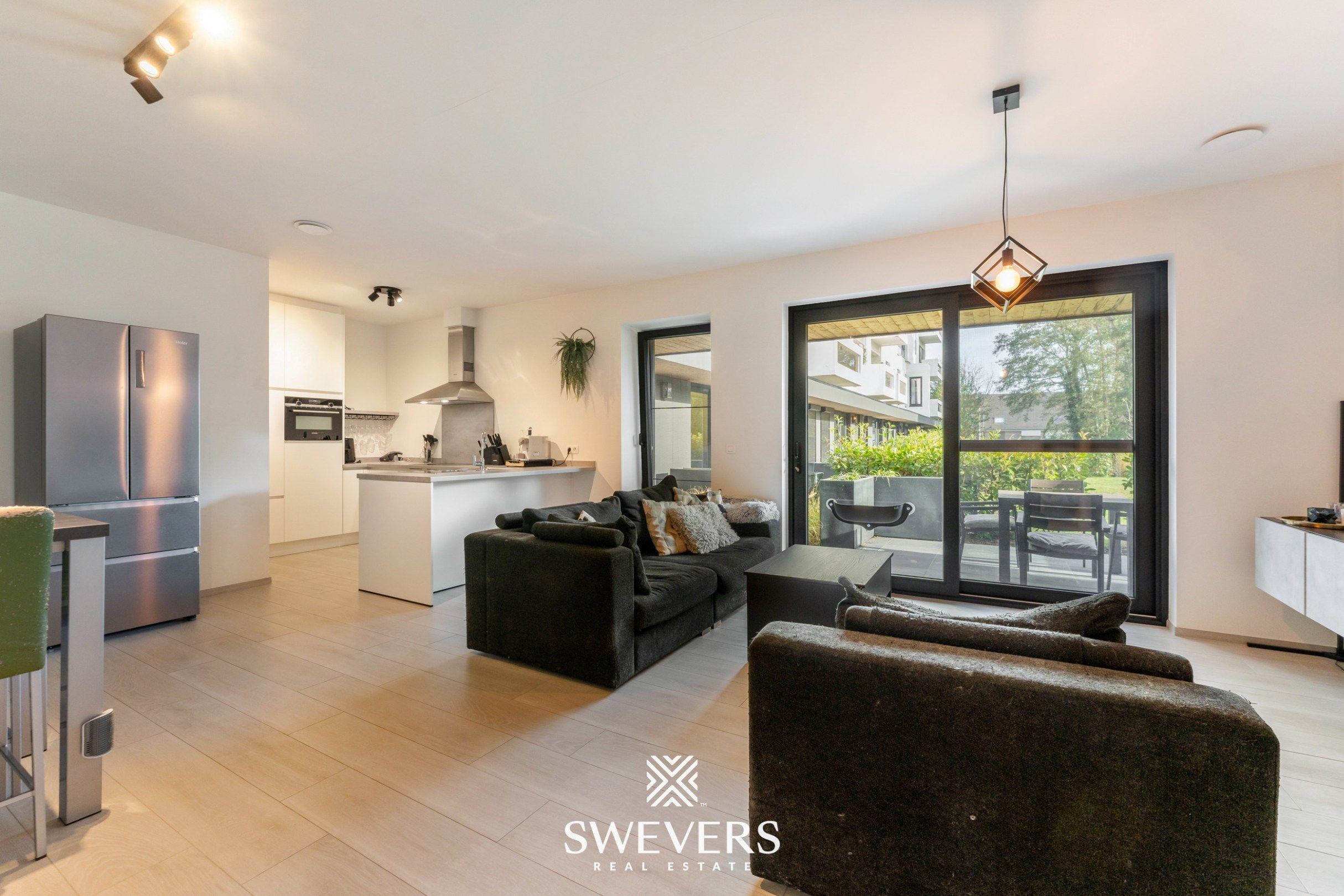 Instapklaar, energiezuinig gelijkvloers appartement (99 m²) met garage en kelders in het pittoreske Bolderberg foto {{pictureIndex}}