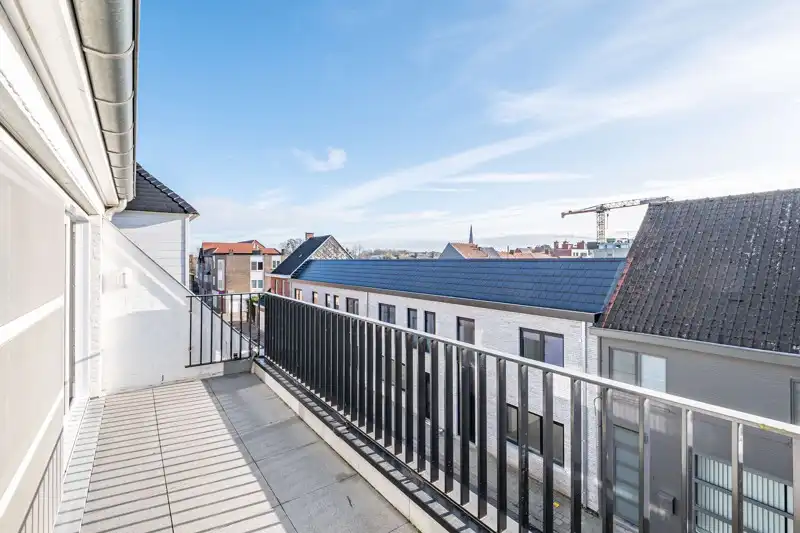 Jong, energiezuinig en modern tweeslaapkamer appartement met mooi terras op de tweede verdieping van residentie Aimé en André in hartje Waregem! foto 7