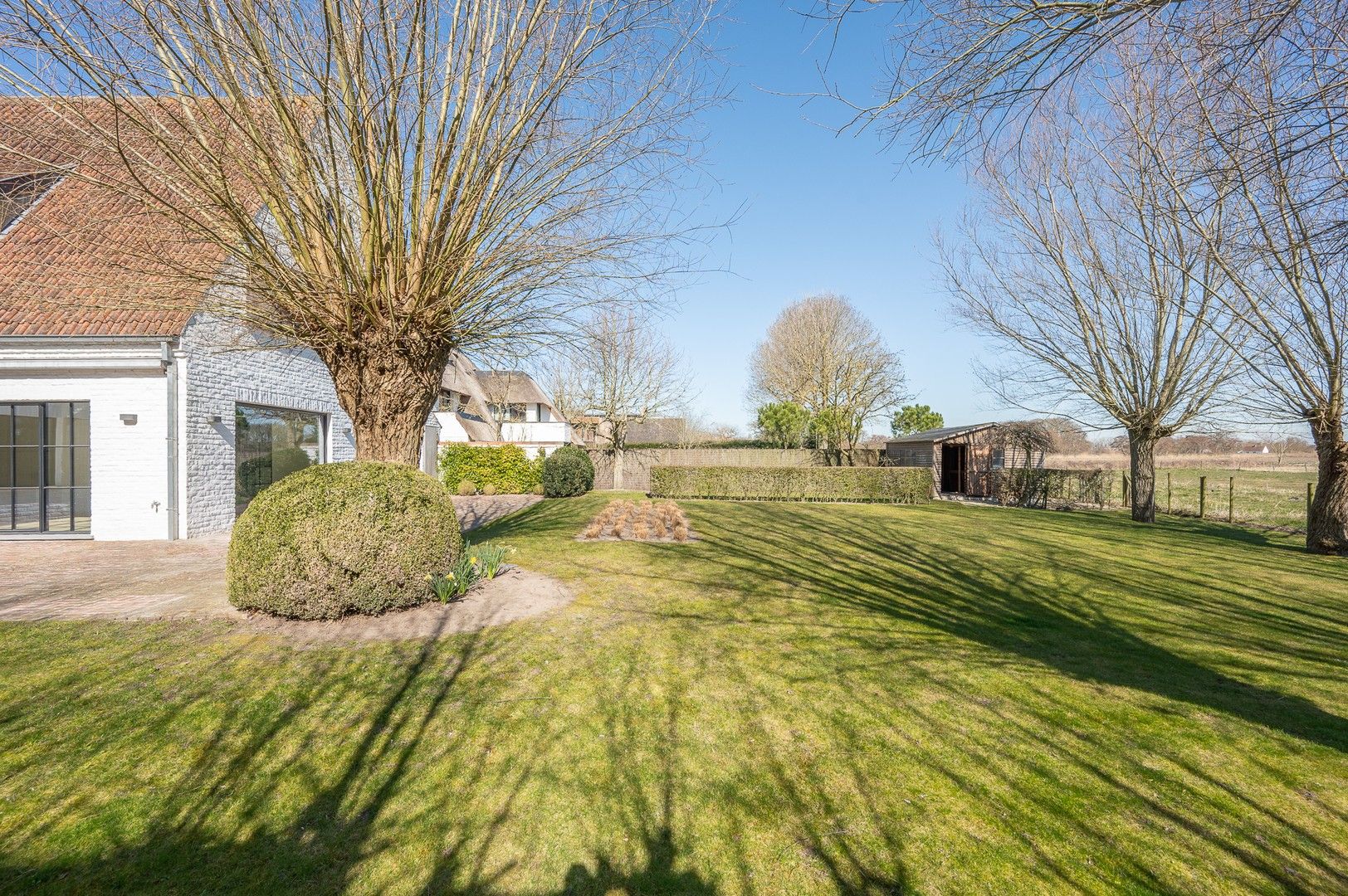 Alleenstaande villa genietend van prachtige open zichten op de polders. foto 13