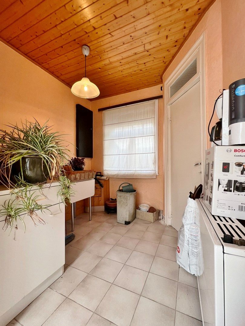 Twee te renoveren woningen met tuintje in de stadskern van Ieper foto 21