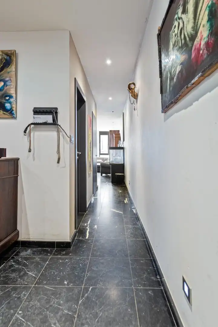 Ruim appartement gelegen op de 1ste verdieping in het centrum van Maaseik! foto 9