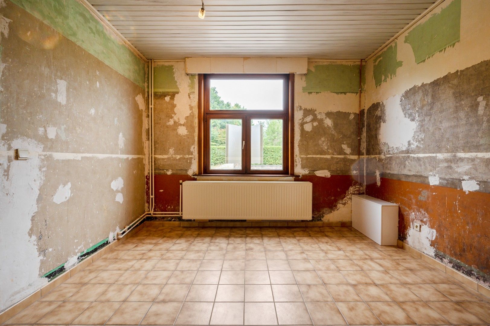 Te renoveren woning met tuin en garage in Wolfsdonk! foto 5