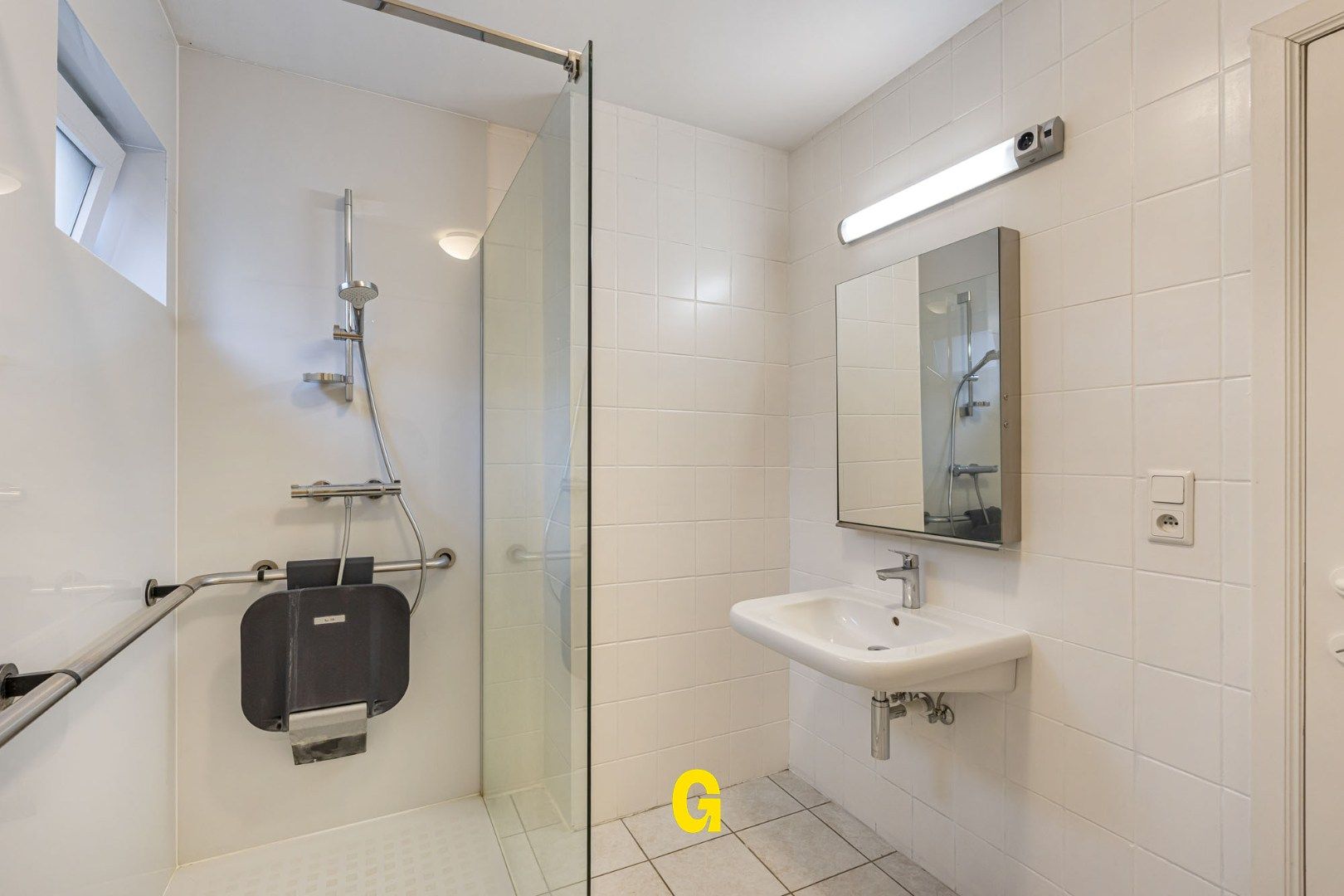 Degelijk (rolstoelvriendelijk) gelijkvoersappartement met terras uitgevend op de tuin, afsluitbare garage en berging foto 16