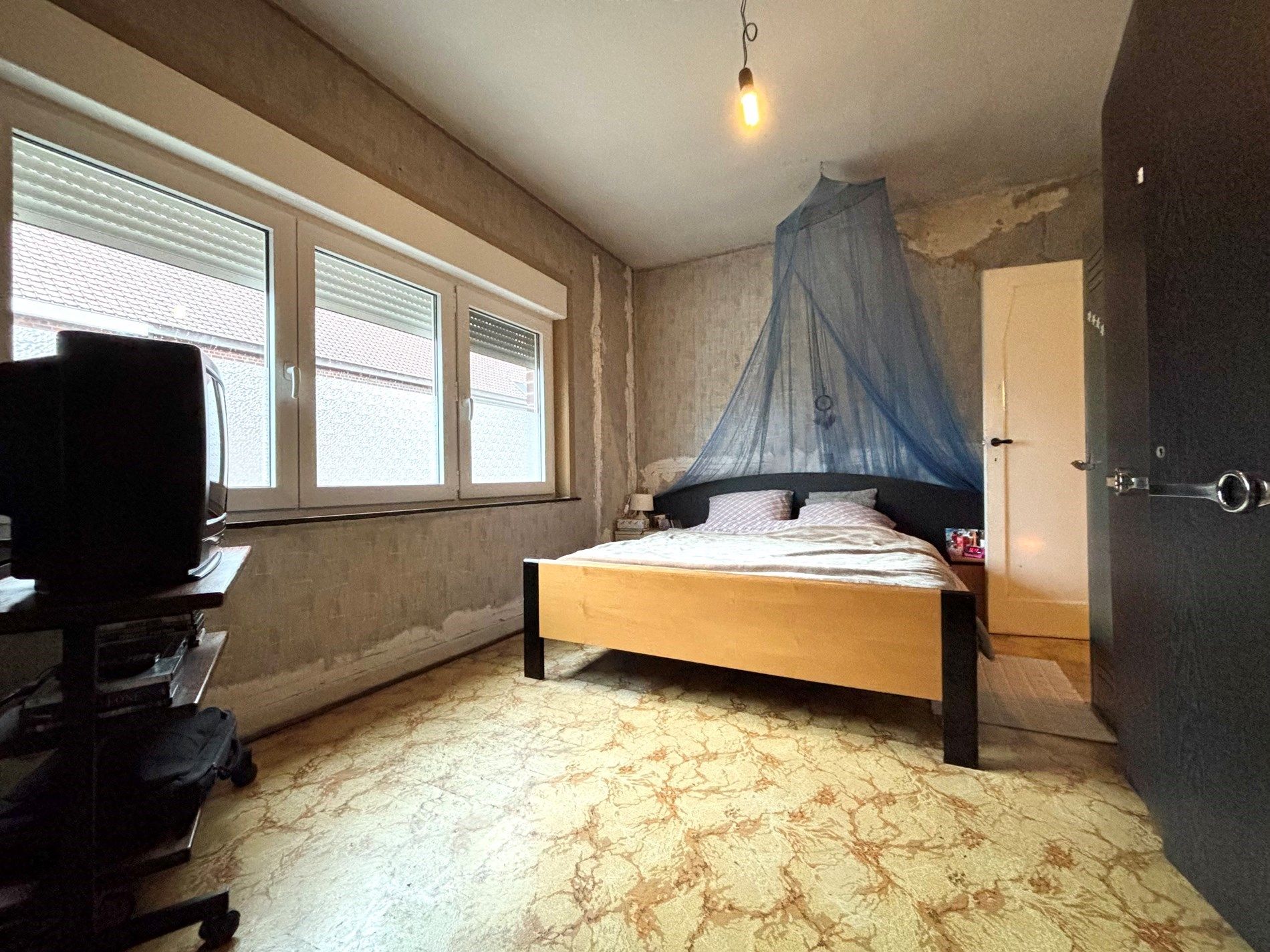 Op te frissen rijwoning met tuin, vernieuwde ramen en geïsoleerd dak. foto 13