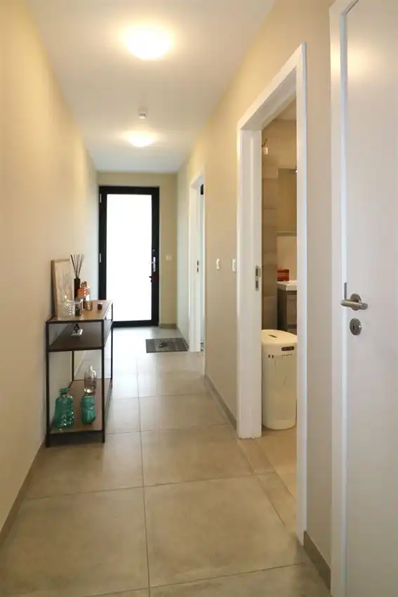 Gelijkvloers appartement met zuidgericht terras en tuintje, autostaanplaats foto 16