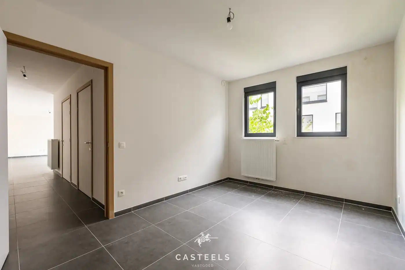 Lichtrijk appartement met grote gemeenschappelijke tuin foto 11