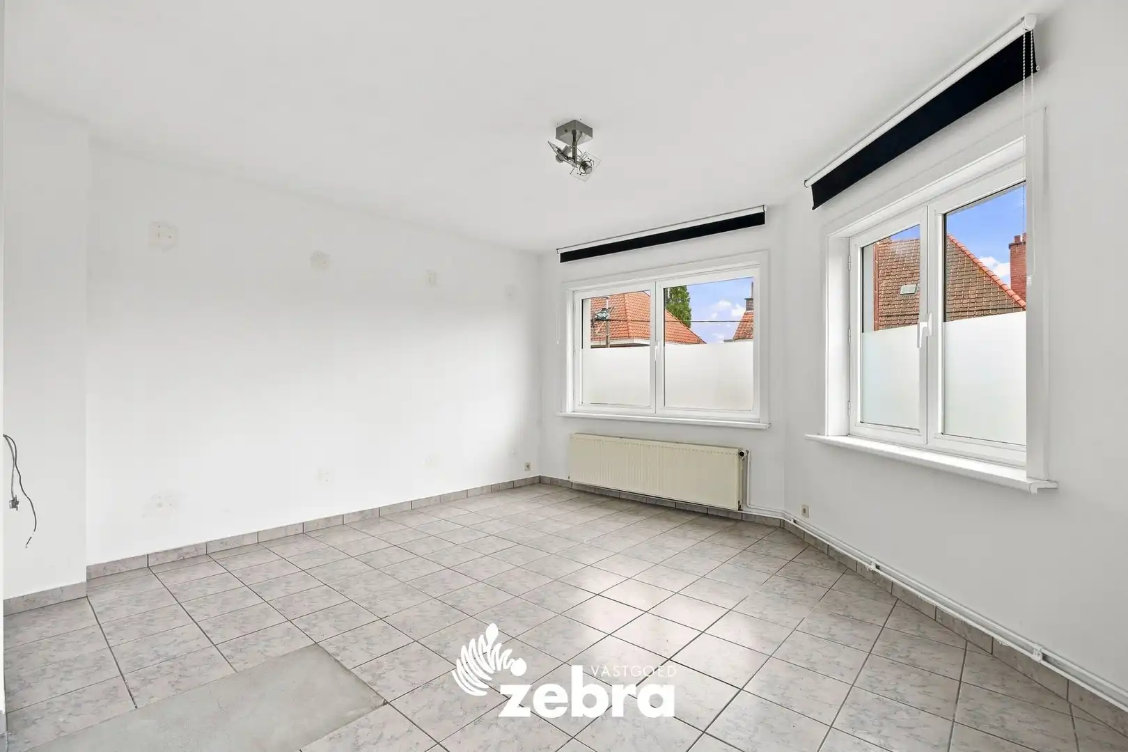Kloeke hoekwoning met veel potentieel in Roeselare! foto 14