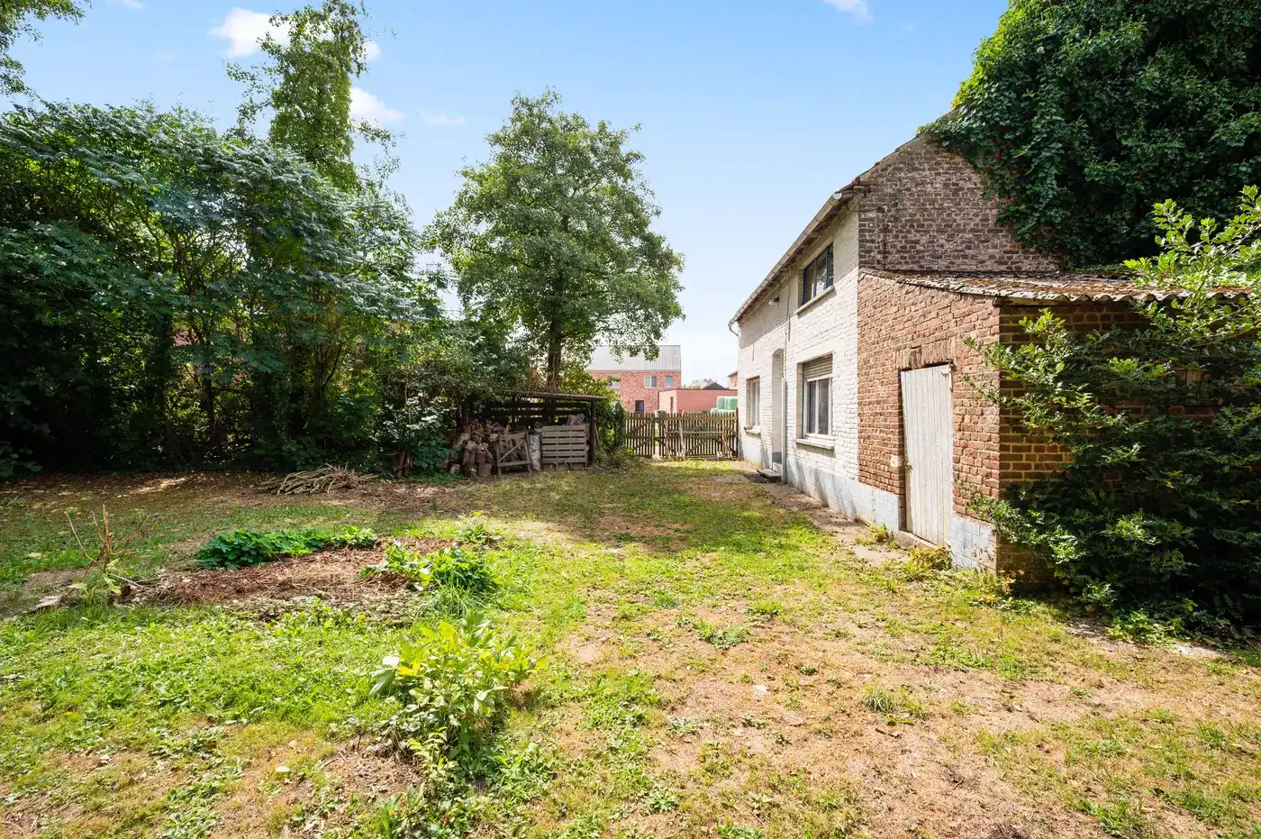 Open bebouwing in Linter met groot perceel en tuin foto 21