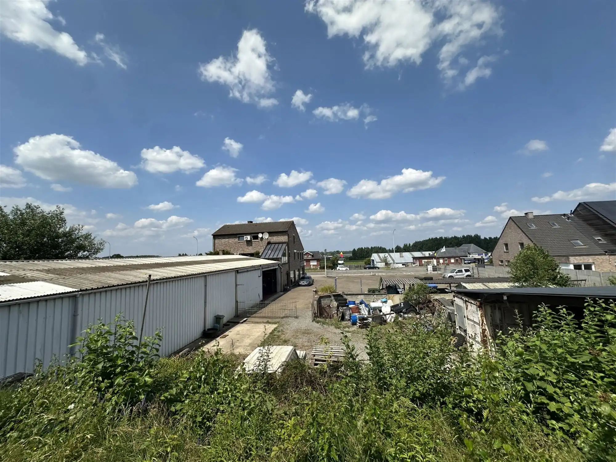 Handelspand met woonst, showroom, loods en parking foto 13