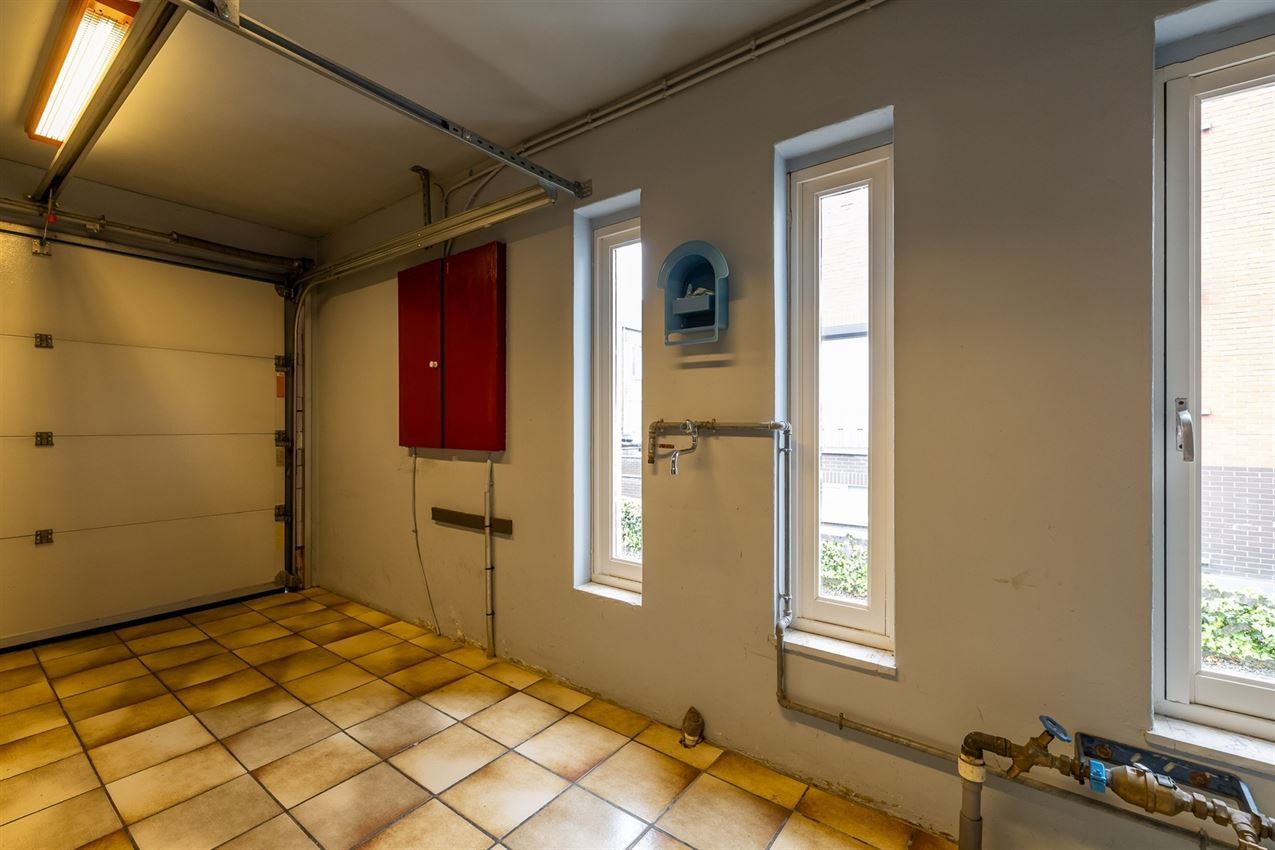 Te renoveren woning met 4 slk. in het hart van Averbode foto 11