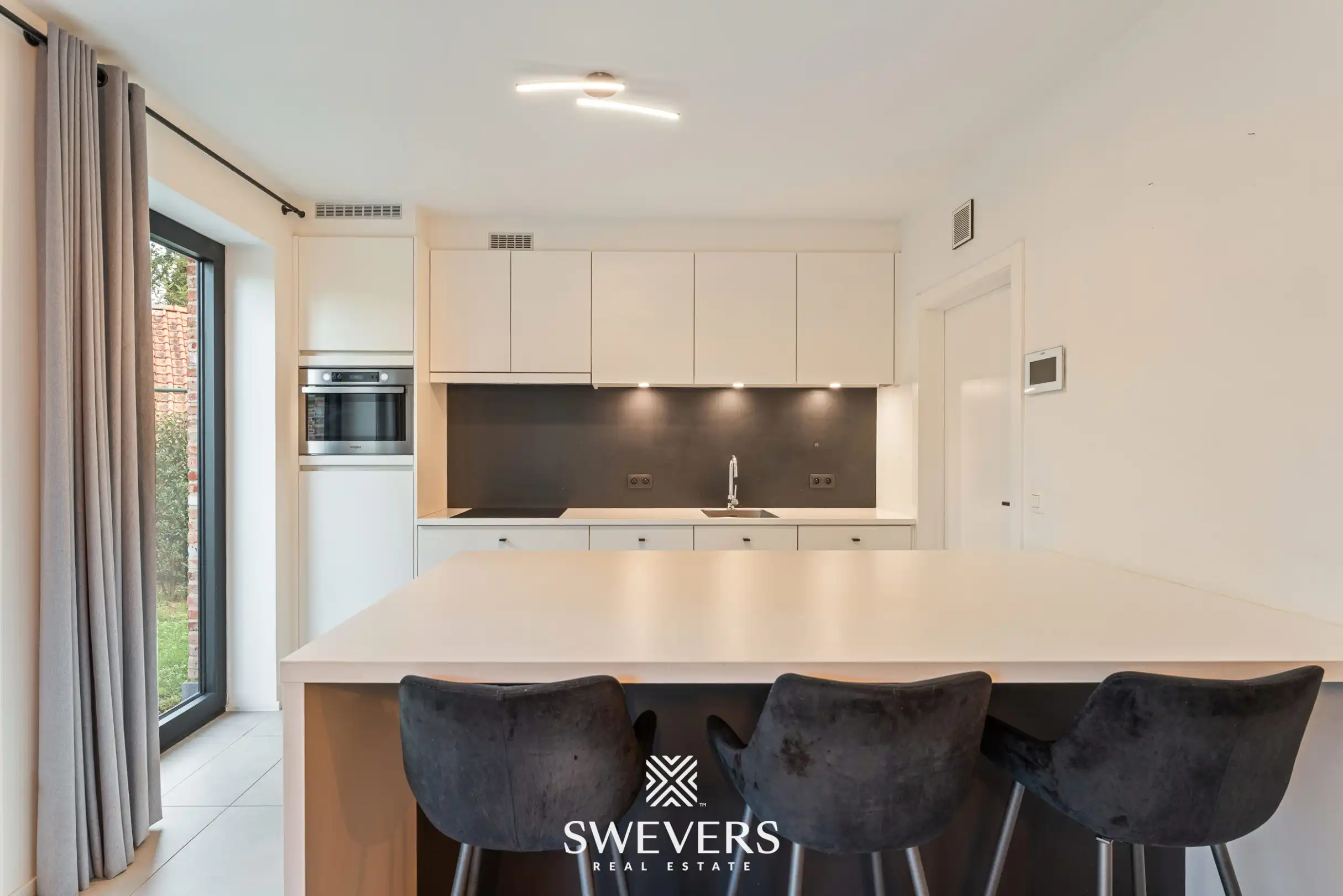 Instapklaar gelijkvloers 2 slpk-appartement met terras en tuin in Heusden. foto 11