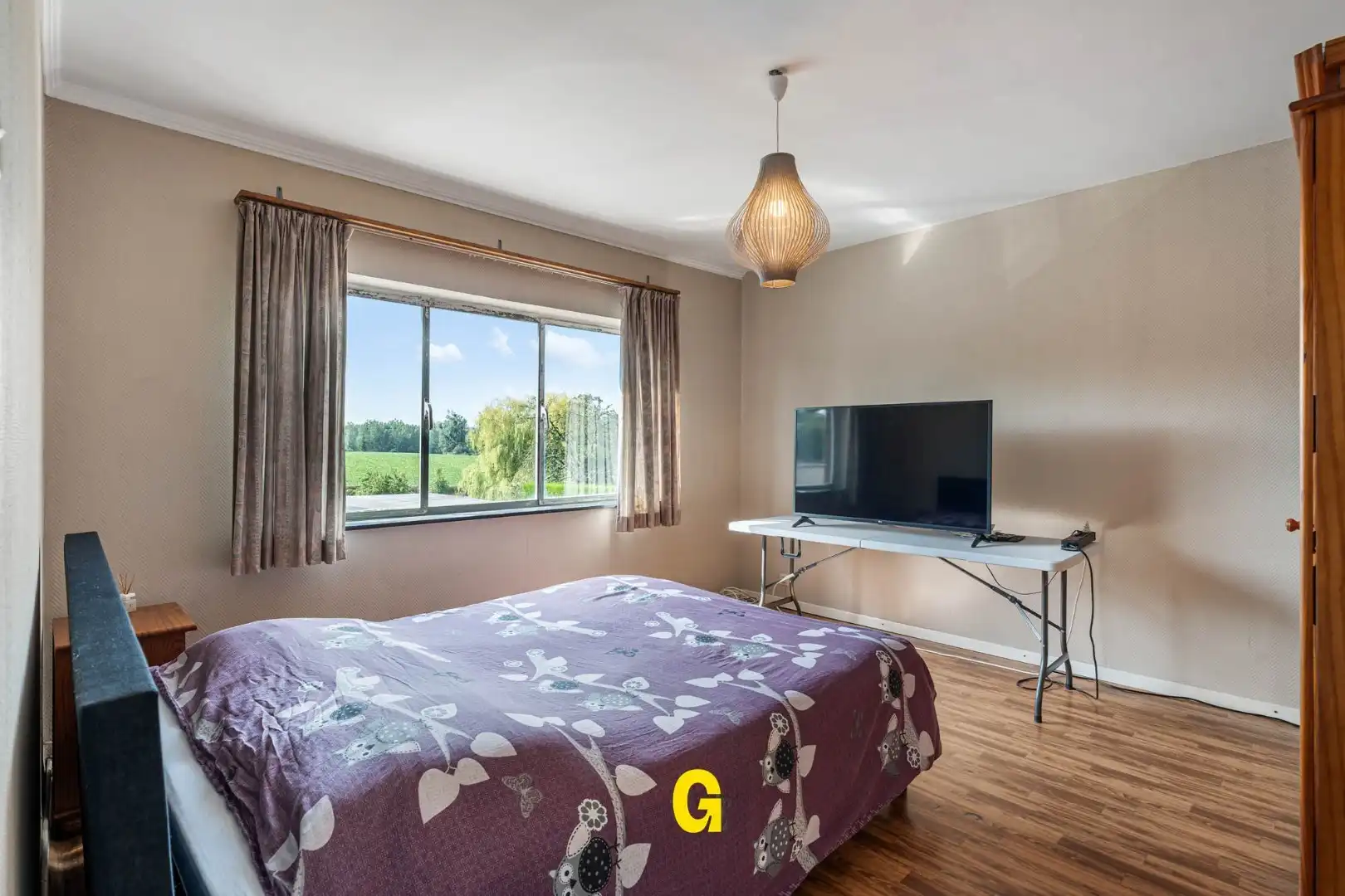 Grondig te renoveren woning met degelijke structuur en ruime tuin op 10a 67ca, met weids zicht op de achtergelegen glooiende groene omgeving foto 15