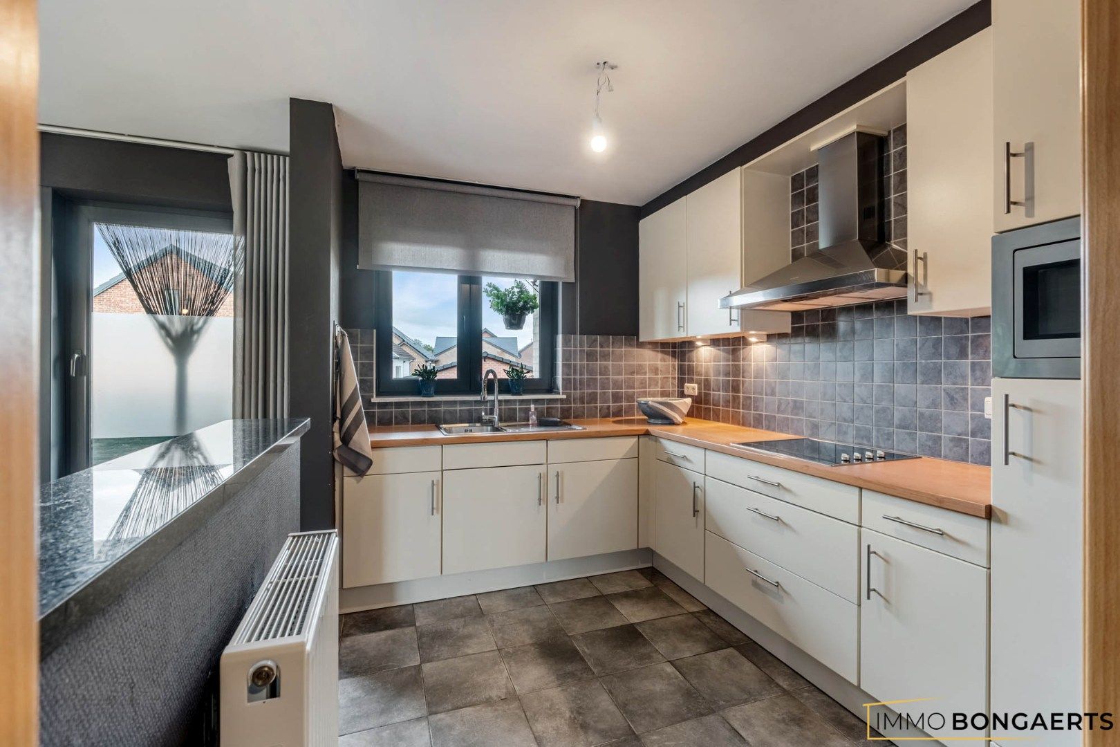 Ruim duplexappartement met 4 slaapkamers foto 11