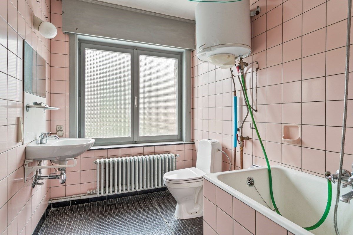 Ruime woning met 4 slaapkamers en garage! foto 14