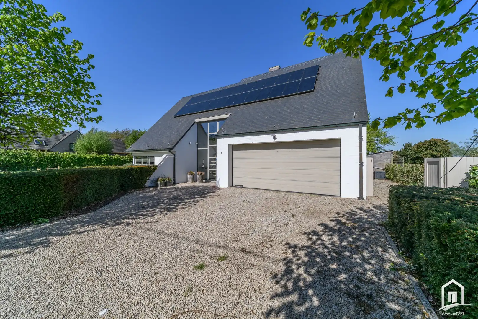 Instapklare villa met 3 SLK's, garage en riante tuin met zwembad foto 27