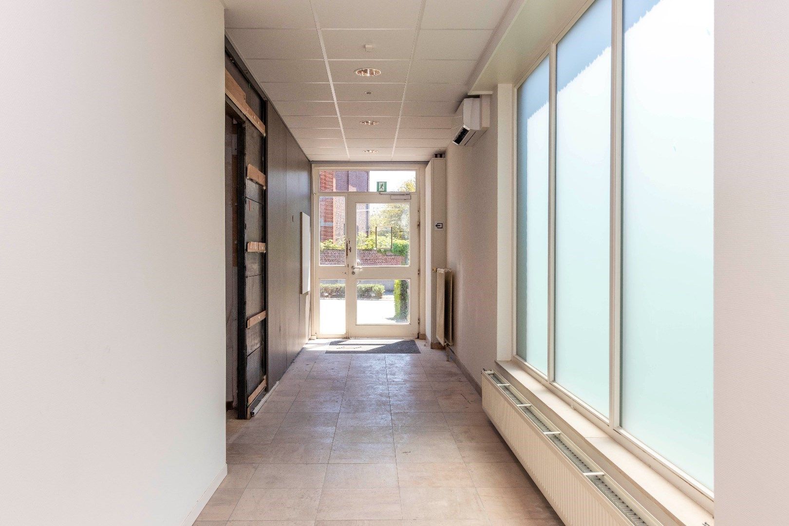 Ruim duplexappartement met gelijkvloerse handelsruimte foto 28