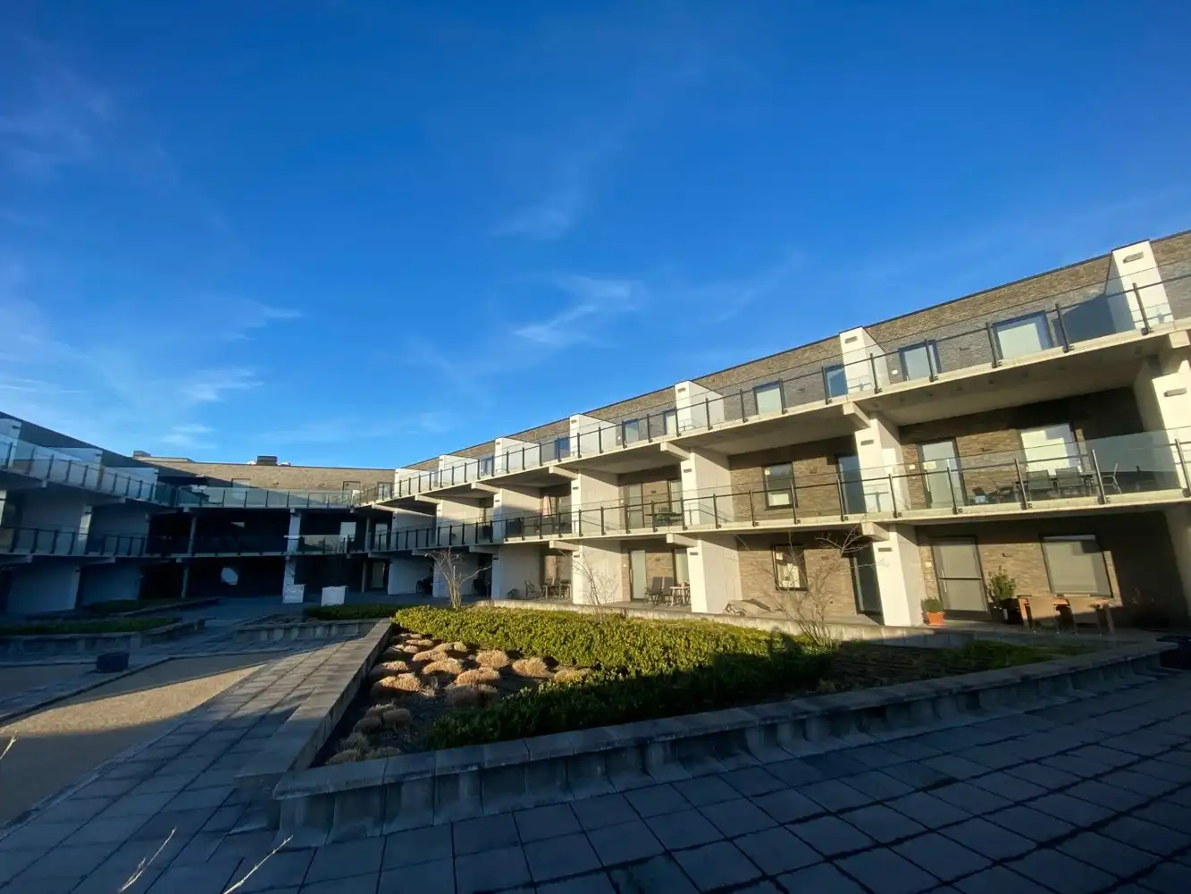 Nieuwbouwappartement met één slaapkamer gelegen in het commercieel centrum van Eisden. foto 2