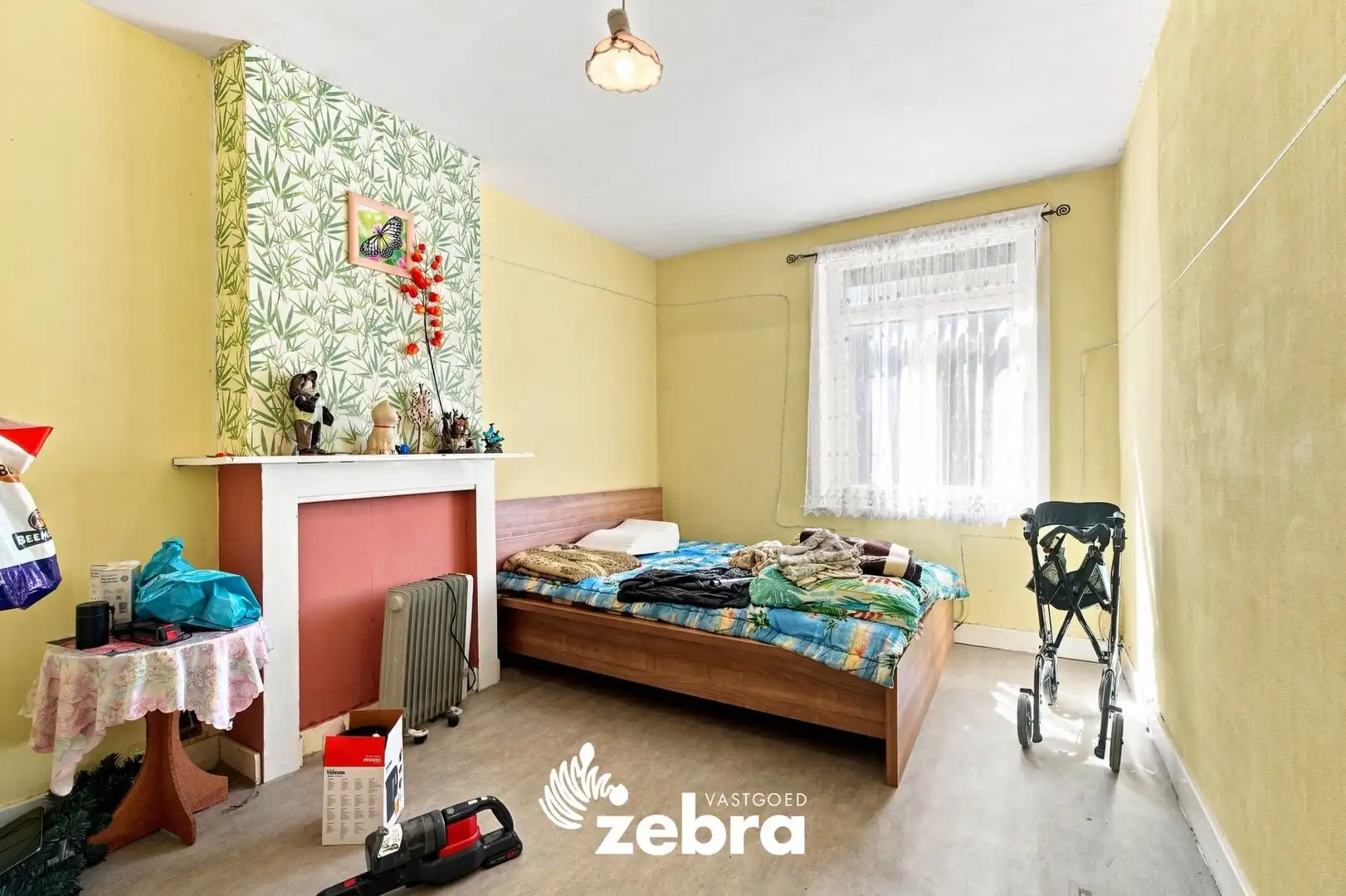 Te renoveren woning met 3 slaapkamers, kelder en zuidwestgerichte stadskoer in Tielt! foto 9